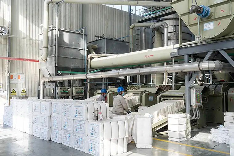 LANDU Worker Dealing With Raw Material Cotton
