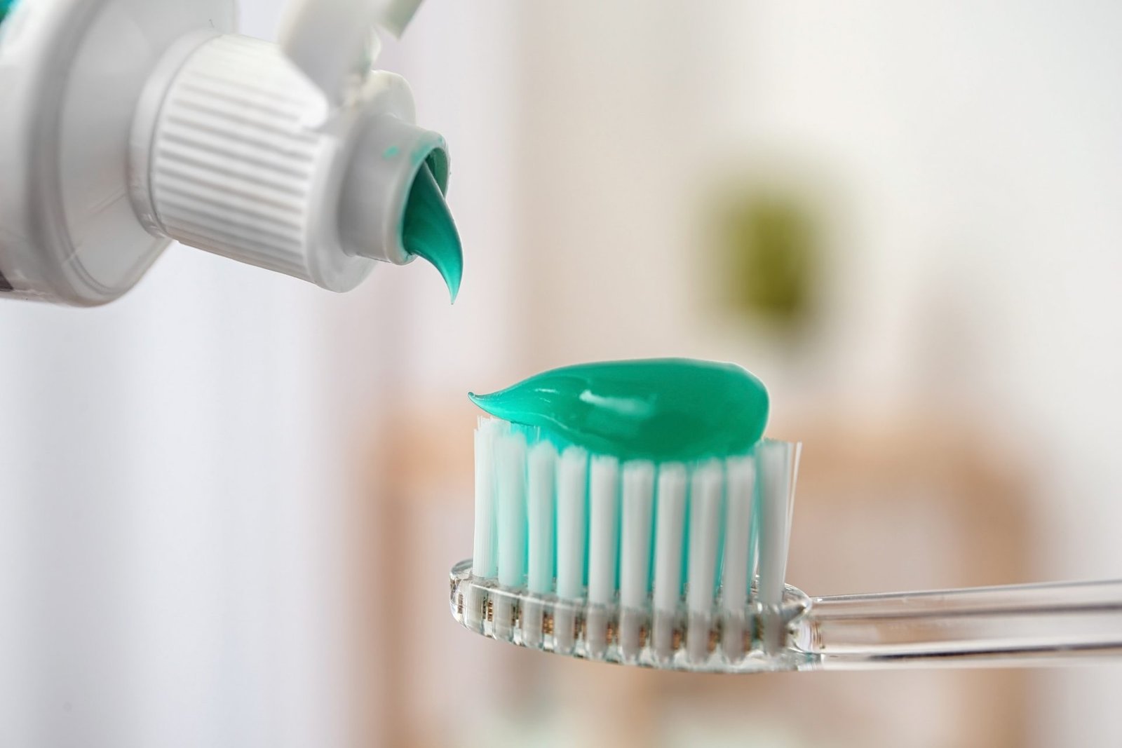 Redlemon Applying Paste On Toothbrush Against Blurred Backg 2026 03 27 02 57 49 Utc Compressed