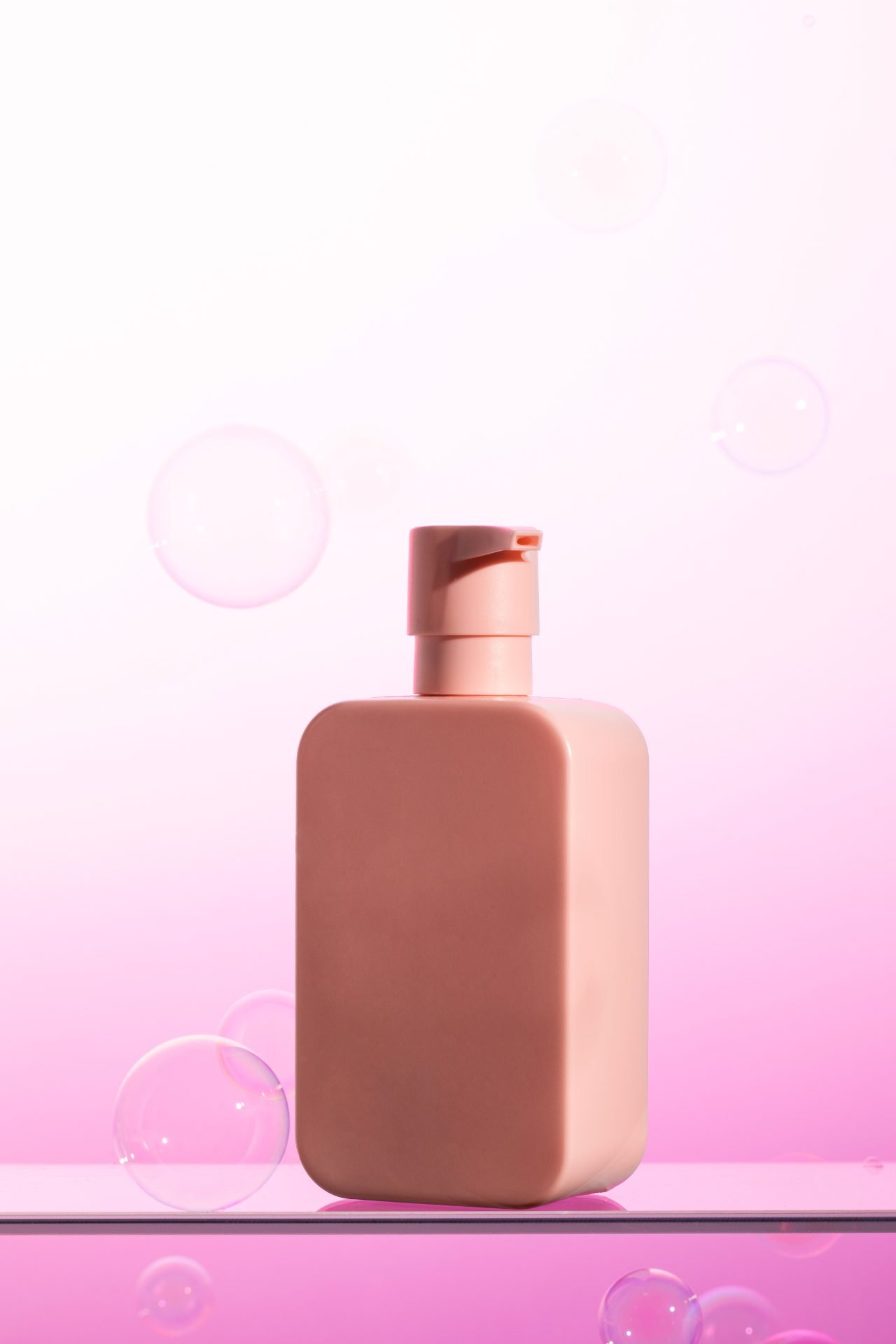 Redlemon Pink Bottle On Glass With Bubbles Background 2026 03 18 17 45 05 Utc Compressed