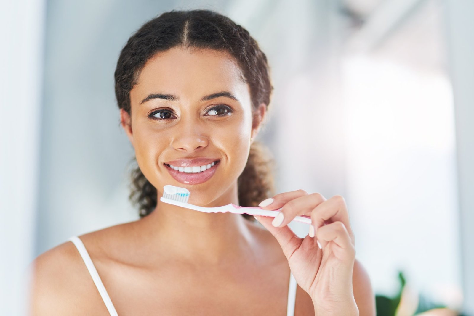 Redlemon Smiling Young Woman Brushing Her Teeth Indoors 2026 01 09 09 37 04 Utc Compressed