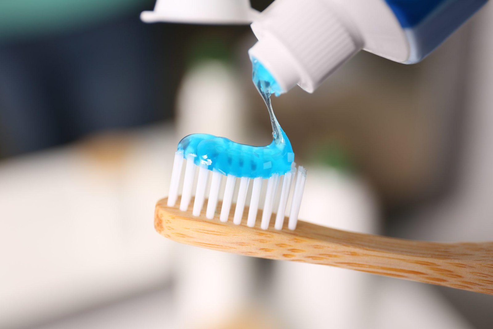 Redlemon Toothpaste Being Squeezed Onto A Wooden Toothbrush 2026 03 27 00 47 06 Utc Compressed