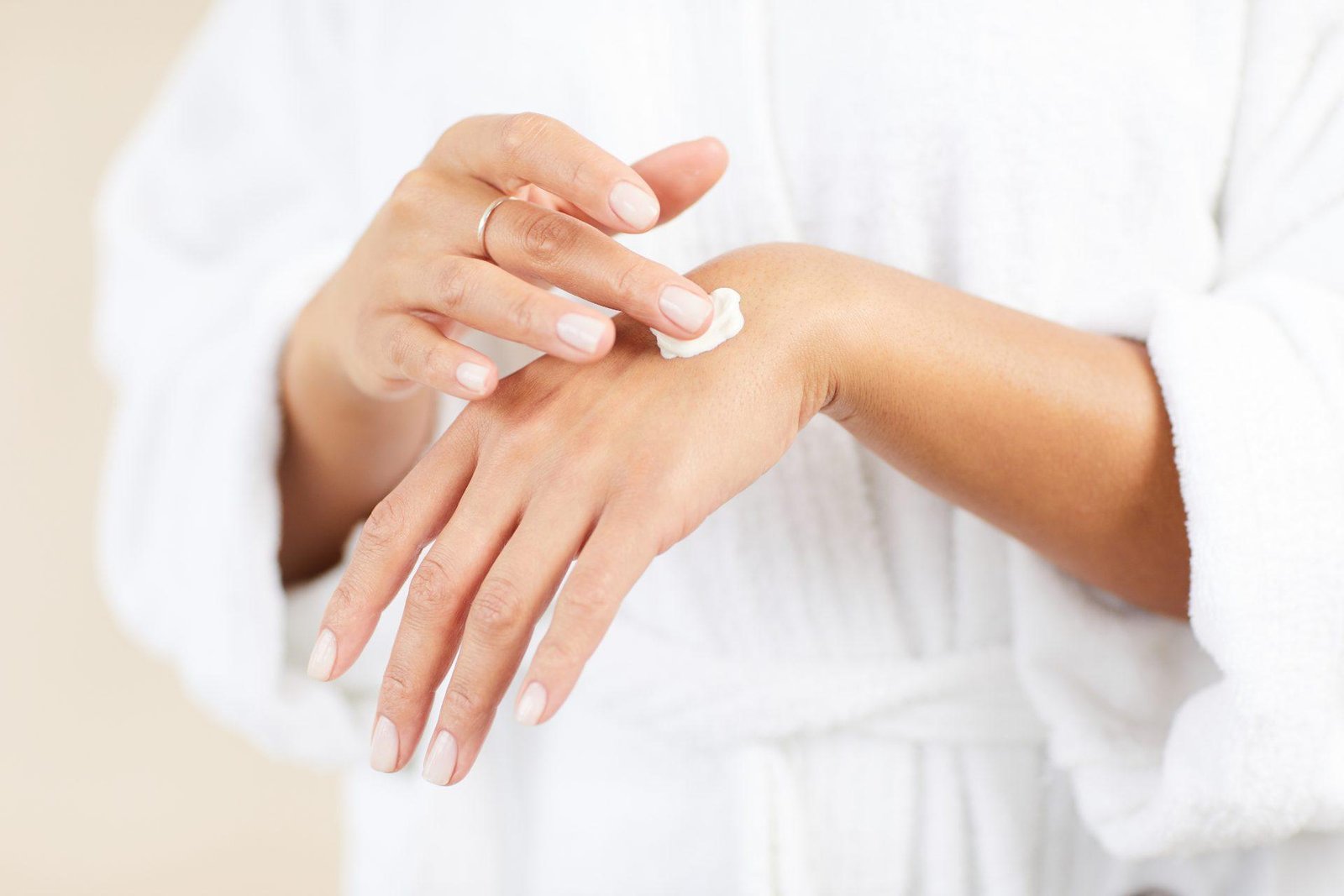 Redlemon Woman Applies Cream To Hand For Self Care 2026 03 20 00 37 34 Utc Compressed