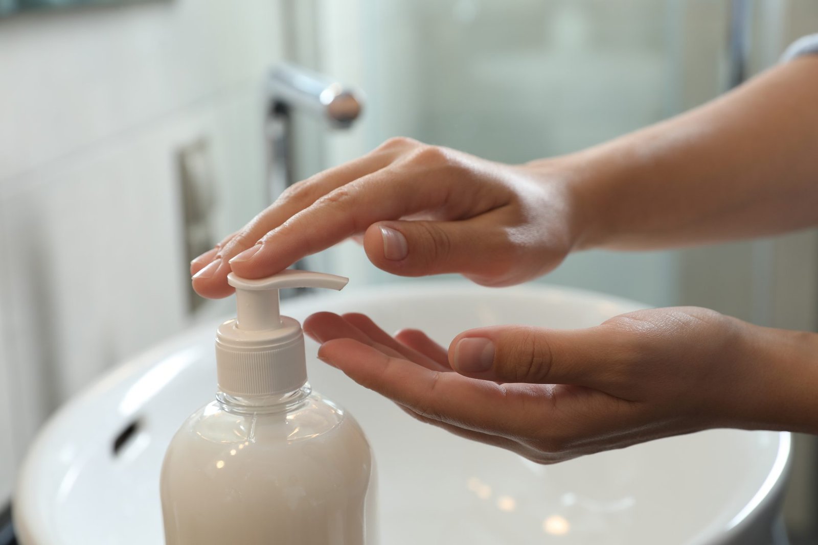 Redlemon Woman Applying Liquid Soap On Hand In Bathroom Cl 2026 03 27 02 57 38 Utc Compressed