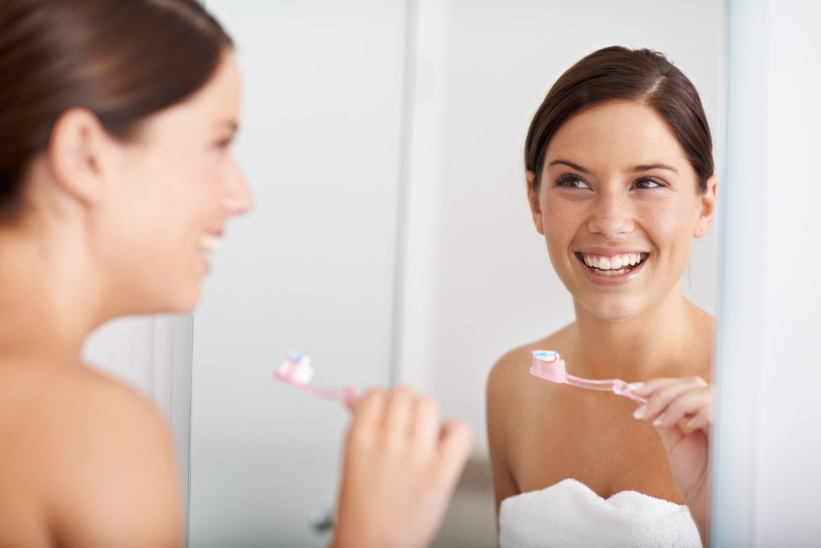 Redlemon Woman Smiling While Brushing Her Teeth In Bathroom 2026 01 09 09 24 18 Utc Compressed